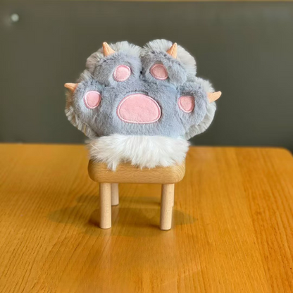 Grey Plush Paw 3D Keychain Displayed on a Small Wooden Stool Against a Neutral Background -Tinyminymo