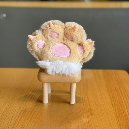 A Beige Plush Paw 3D Keychain Placed on a Wooden Stool Against a Neutral Background - Tinyminymo