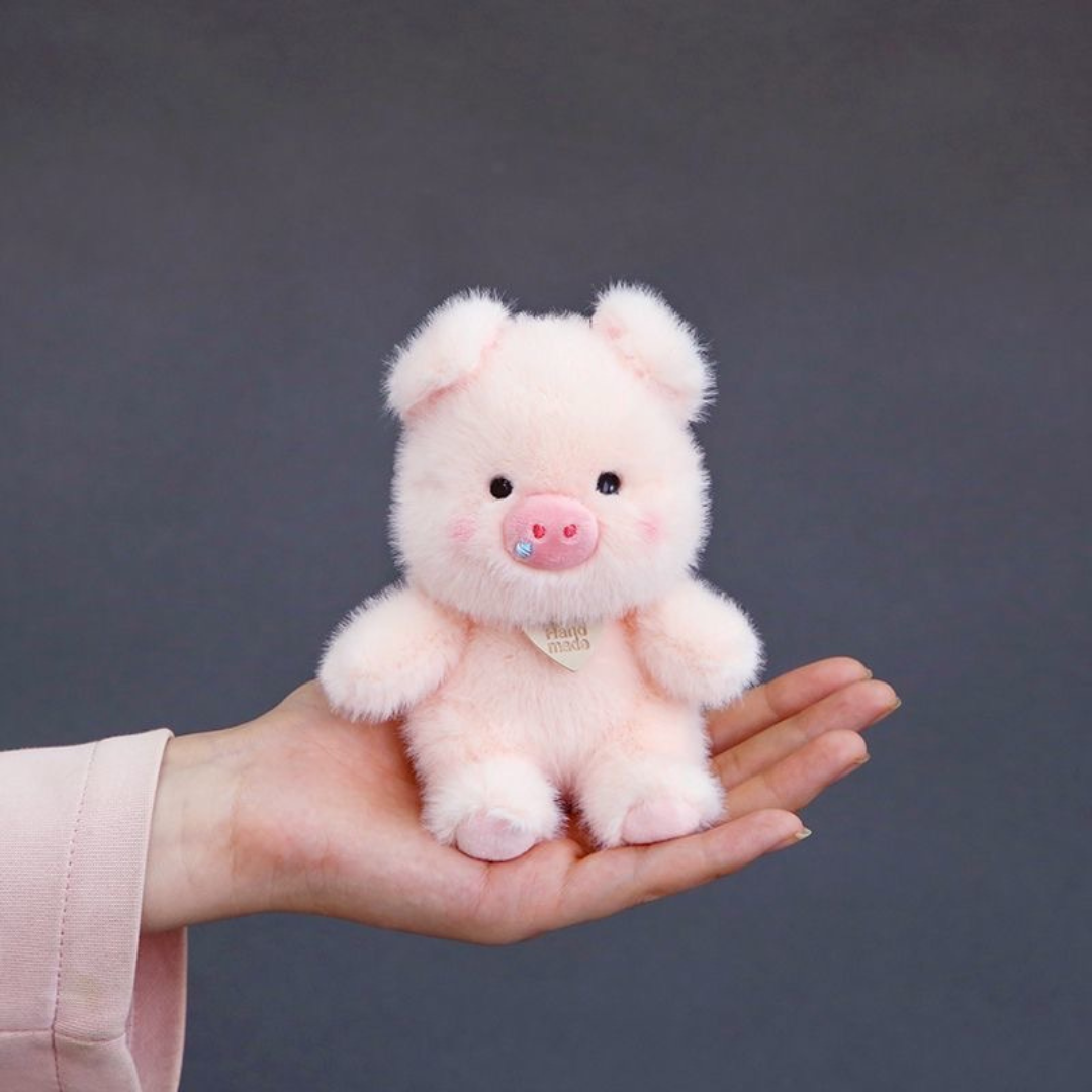 Plush Piggy 3D Keychain in Pink Color Held in a Hand Against a Dark Background - Tinyminymo