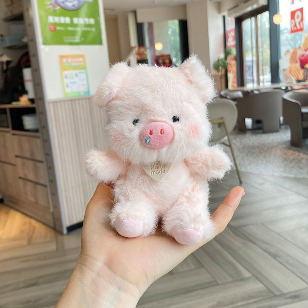 A Pink Plush Piggy 3D Keychain Sitting on a Person’s Hand - Tinyminymo