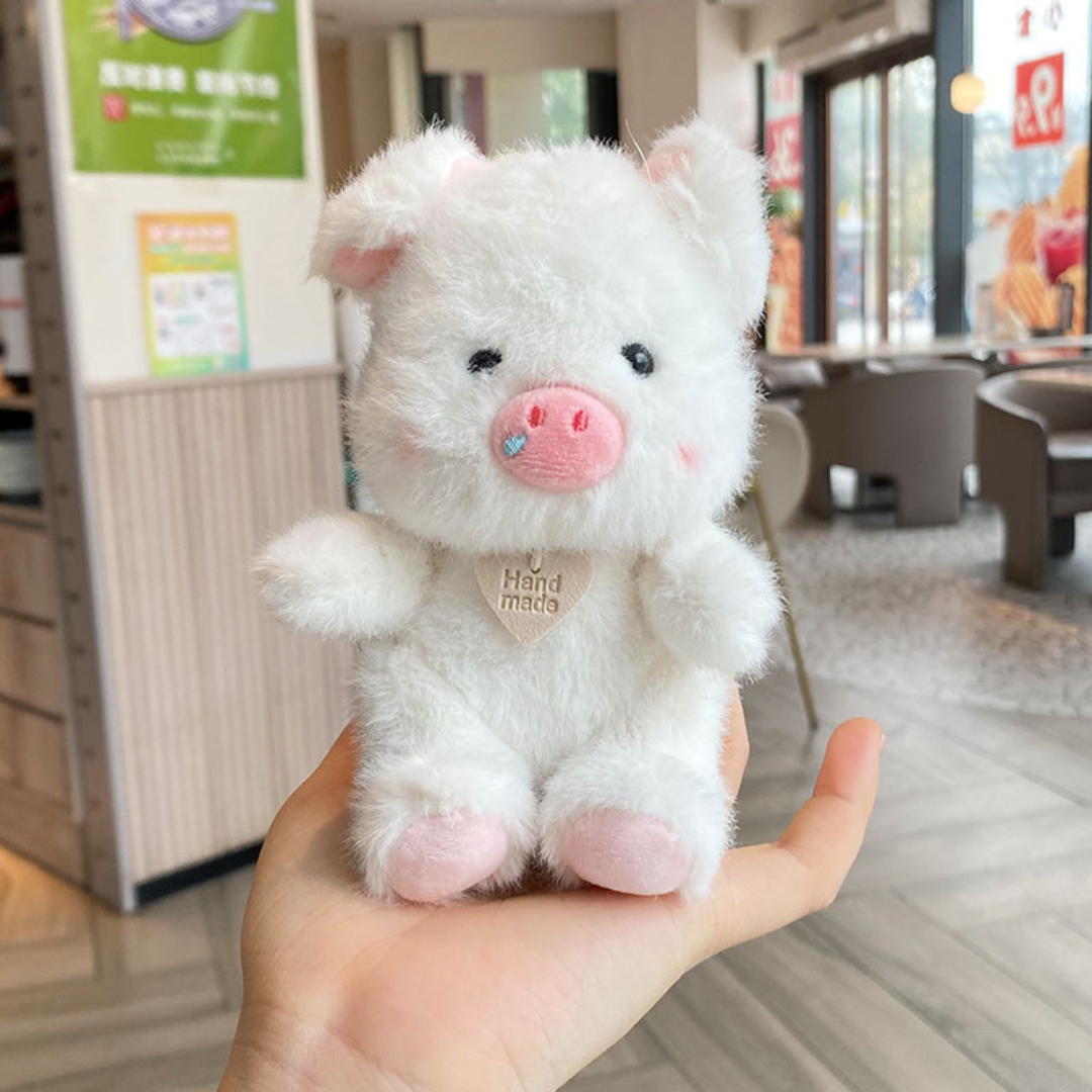 White Plush Piggy 3D Keychain Sitting on a Person's Hand - Tinyminymo