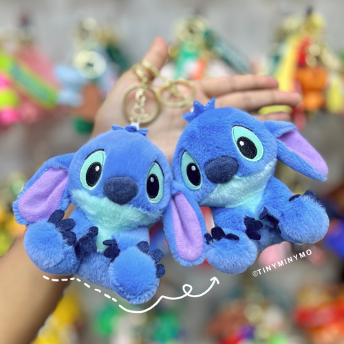 Two Blue Plush Stitch 3D Keychains Held in Hand Against a Blurred Background - Tinyminymo