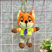 Plush Zootopia 3D Keychain with a Green Shirt and Blue Tie on a Grid Background - Tinyminymo