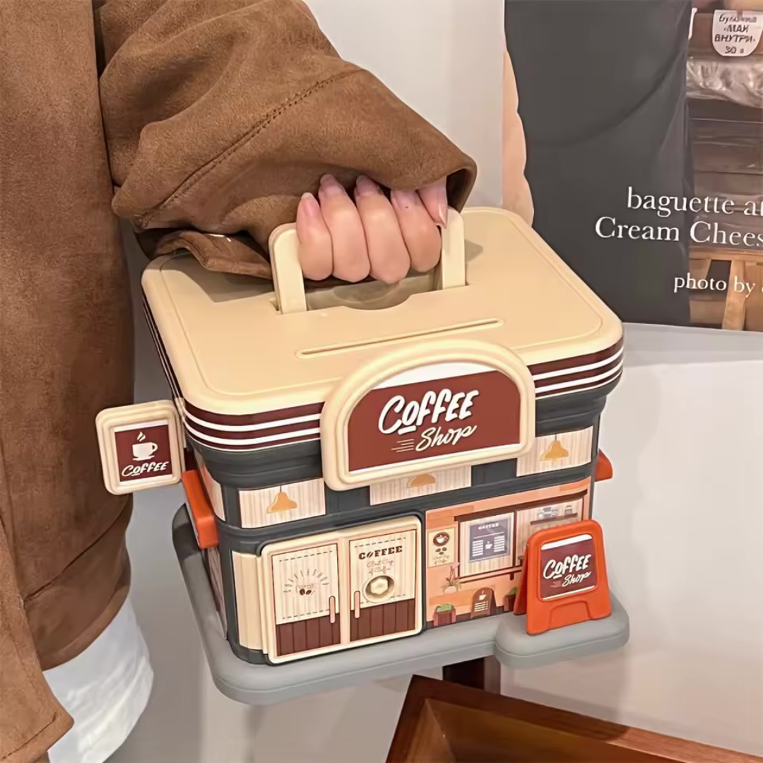 Portable Store Shaped Piggy Bank in Coffee shop design held by a person - Tinyminymo