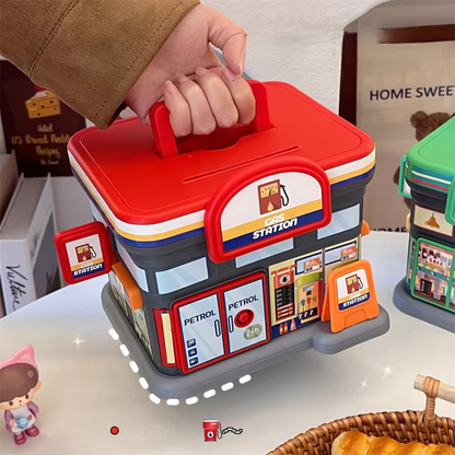 Portable Store Shaped Piggy Bank, Gas Station with a hand holding it, on a white surface - Tinyminymo