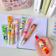 Group of Colorful Push Erasers on a Notebook with a Hand Holding One of Them - Tinyminymo