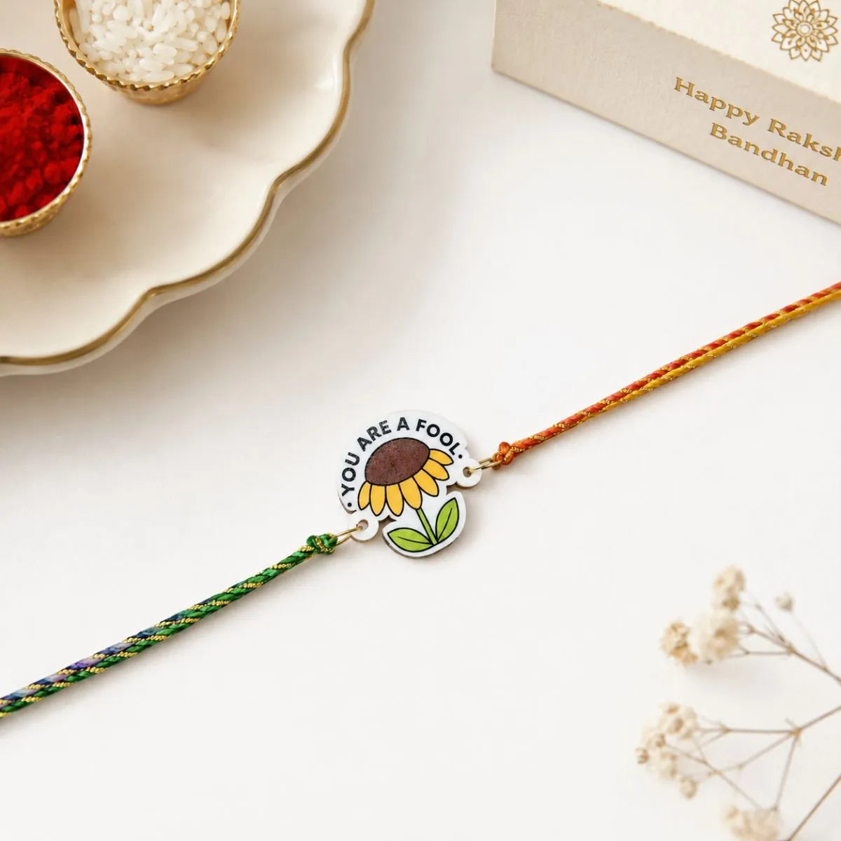 A Braided Rakhi with a Sunflower Charm - Tinyminymo