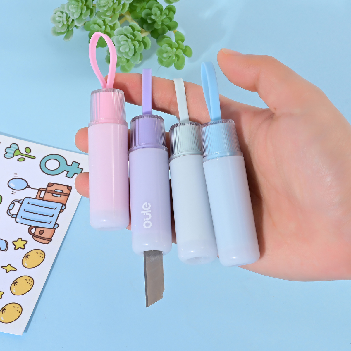 Four Paper Cutters Held by a Hand - Tinyminymo
