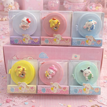 Load image into Gallery viewer, All designs of Sanrio themed tape measures in clear packaging - Tinyminymo
