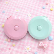 Backside of Measuring Tapes showcasing the Retract Button - Tinyminymo