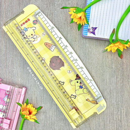Sanrio Paper Trimmer - Pompompurin on a Wooden Surface with Flowers and Stationery Items - Tinyminymo