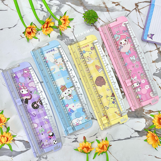 Set of Colorful Sanrio Paper Trimmers on a Textured Surface with Flowers Around - Tinyminymo
