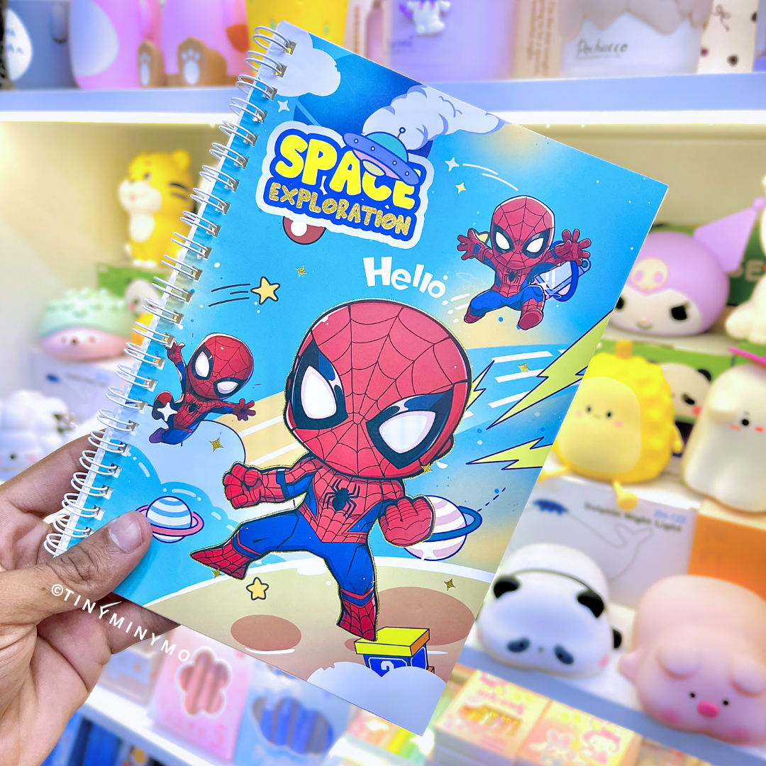 Spiderman Notebook held in front of a display of toys - Tinyminymo