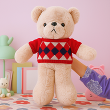 Load image into Gallery viewer, Winter Teddy Soft Toy wearing a Red Sweater held by a Hand - Tinyminymo
